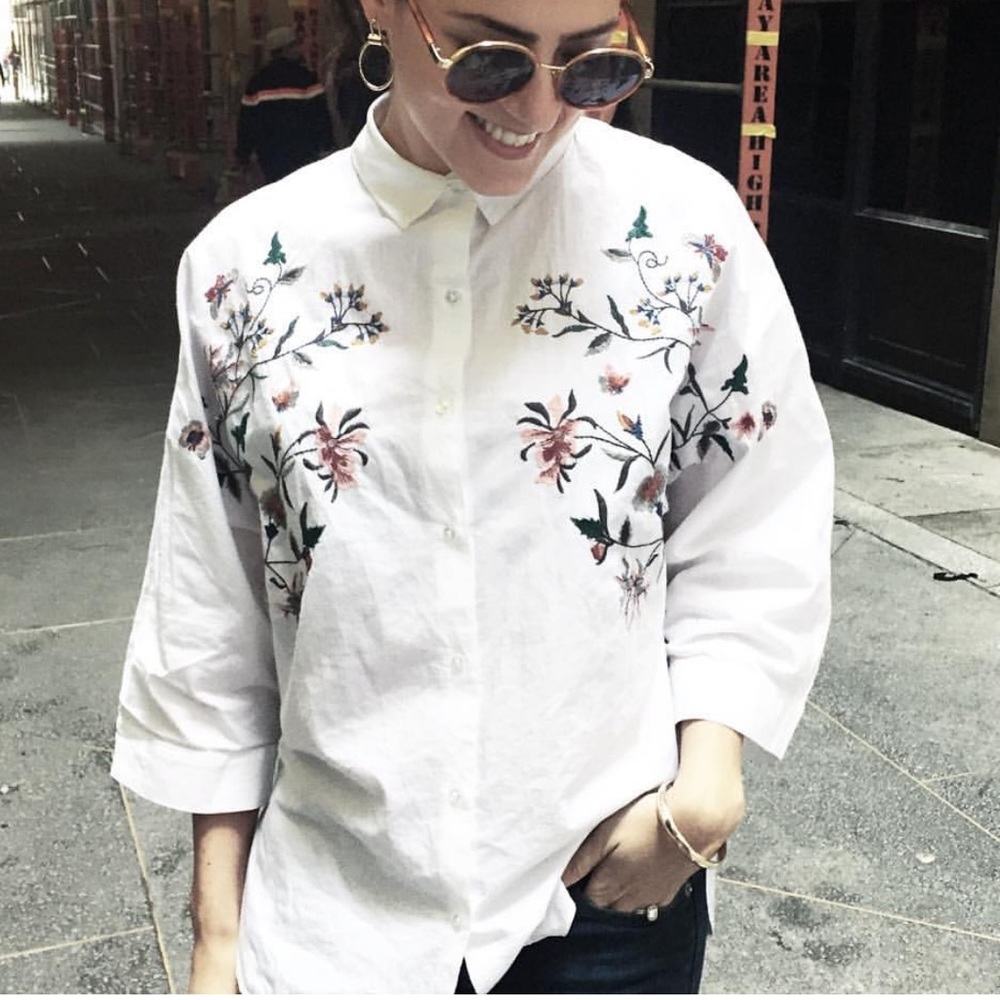 White blouse with embroidered flowers
